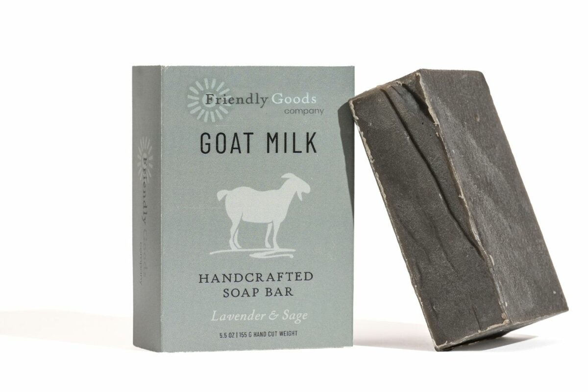 Lavender & Sage Goat Milk Soap Bar unwrapped and also in packaging, standing up against a white background