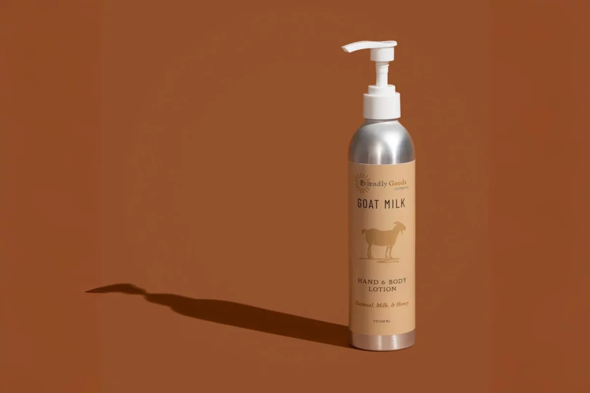 Friendly Goods Company Oatmeal Milk & Honey Goat Milk Lotion on a camel brown background for display